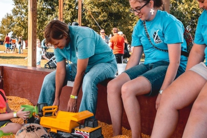 a group of people sitting on a bench